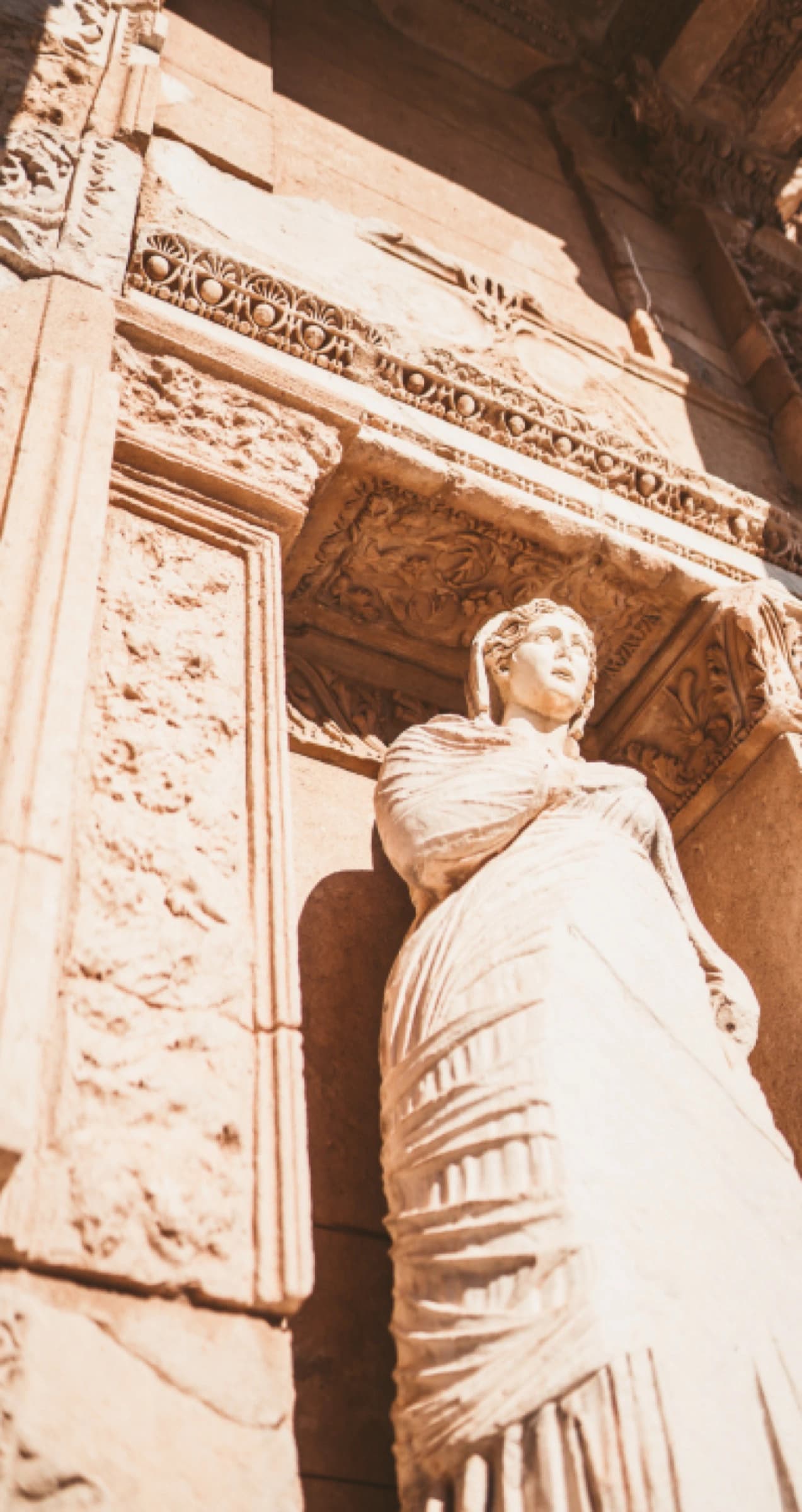 A marble statue in a niche of the Library of Celsus at Ephesus