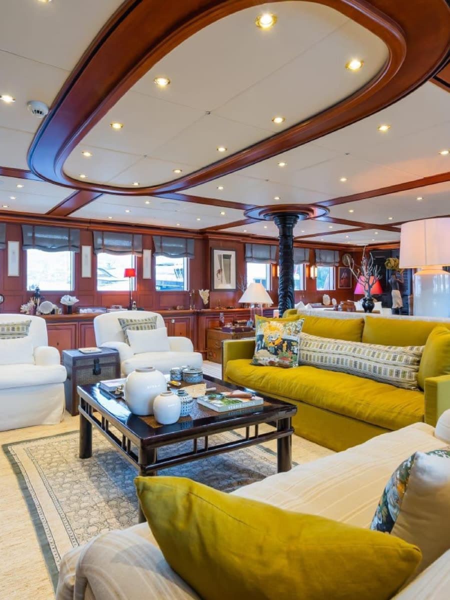 The saloon — mahogany, brass, and deep seating