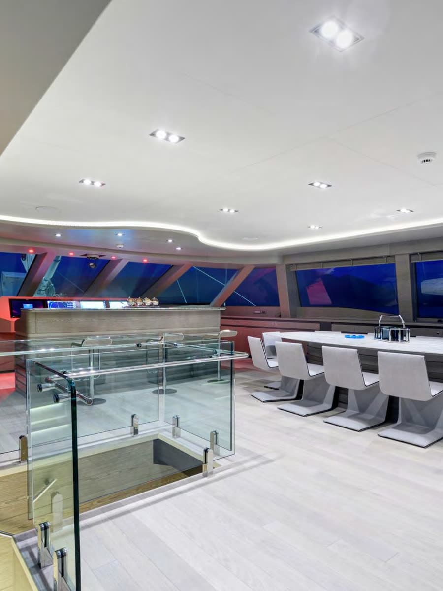 The saloon — pale timber and glass, open to the horizon