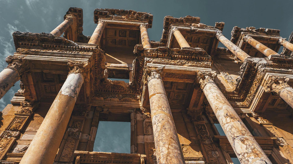 Looking up at the carved columns and facade of the Library of Celsus in Ephesus.