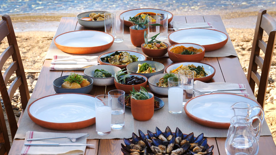 A seaside table of Aegean meze and mussels laid by the strait