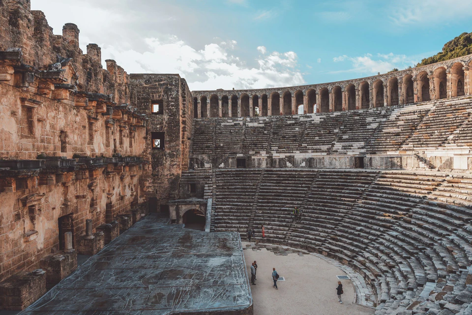 The intact stage wall and sweeping stone cavea of the Roman theatre at Aspendos