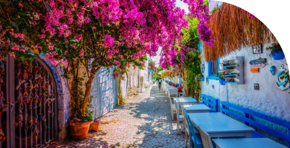 Bougainvillea-covered 19th century Greek houses in Alaçatı Old Town