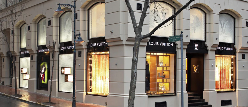 The lamplit windows of a designer boutique on a Nisantasi street corner.