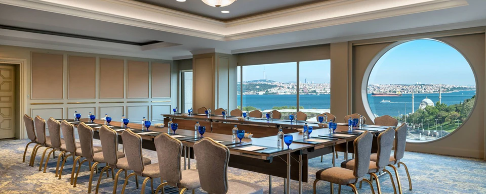 A boardroom with panoramic windows overlooking the Bosphorus